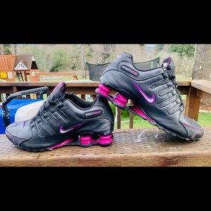 Women’s black and pinkish purple Nike shox.